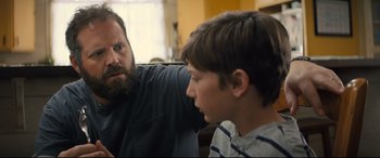 Movie still from “Brightburn” (2019), directed by David Yarovesky – A man and a boy are talking to each other; Close Up shot, Over the shoulder angle