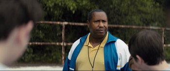 Movie still from “Brightburn” (2019), directed by David Yarovesky – A man in a yellow shirt and a blue and white jacket; Close Up shot, Over the shoulder angle