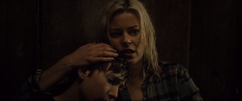 Movie still from “Brightburn” (2019), directed by David Yarovesky – A young man and a young woman with their hands on their heads; Close Up shot, Low angle