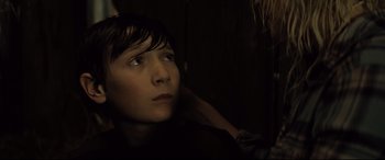 Movie still from “Brightburn” (2019), directed by David Yarovesky – A young person is looking up at the sky; Close Up shot, Over the shoulder angle