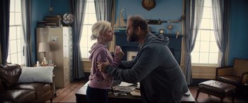 Movie still from “Brightburn” (2019), directed by David Yarovesky – A man and a woman are in a room together; Medium shot, Over the shoulder angle