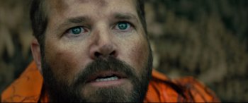 Movie still from “Brightburn” (2019), directed by David Yarovesky – A person with a beard and blue eyes; Close Up shot, Over the shoulder angle