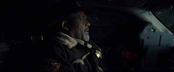 Movie still from “Brightburn” (2019), directed by David Yarovesky – A police officer sitting in the back of a car; Close Up shot, Over the shoulder angle