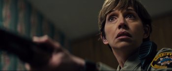 Movie still from “Brightburn” (2019), directed by David Yarovesky – A person with a pen in their hand; Close Up shot, Over the shoulder angle