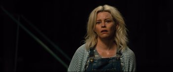 Movie still from “Brightburn” (2019), directed by David Yarovesky – A woman with blond hair wearing overalls and a sweater; Close Up shot, Over the shoulder angle