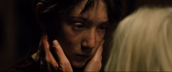 Movie still from “Brightburn” (2019), directed by David Yarovesky – A person holding their head with their hands; Extreme Close Up shot, High angle