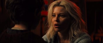 Movie still from “Brightburn” (2019), directed by David Yarovesky – A woman with blonde long hair looking at the camera; Close Up shot, Over the shoulder angle