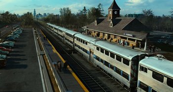 Movie still from “Source Code” (2011), directed by Duncan Jones – A train station with several trains parked on the tracks; Extreme Wide shot, High angle