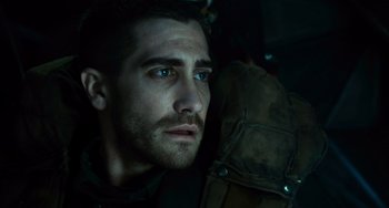 Movie still from “Source Code” (2011), directed by Duncan Jones – A person with a backpack; Close Up shot, Low angle