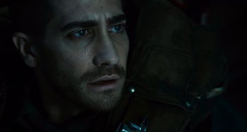 Movie still from “Source Code” (2011), directed by Duncan Jones – A man's face in the dark; Close Up shot, Low angle