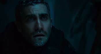 Movie still from “Source Code” (2011), directed by Duncan Jones – A person wearing a jacket; Close Up shot, Over the shoulder angle