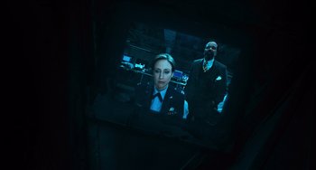 Movie still from “Source Code” (2011), directed by Duncan Jones – A man and a woman in a room with lights on; Close Up shot, High angle