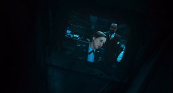 Movie still from “Source Code” (2011), directed by Duncan Jones – A man and a woman are looking in a mirror; Close Up shot, Over the shoulder angle
