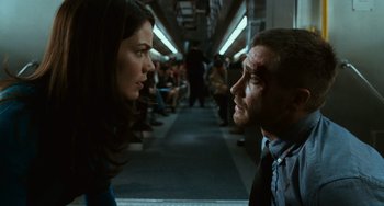 Movie still from “Source Code” (2011), directed by Duncan Jones – A man and a woman are standing in a train; Close Up shot, Low angle