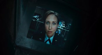 Movie still from “Source Code” (2011), directed by Duncan Jones – A picture of a woman in a uniform is projected on a screen; Close Up shot, High angle
