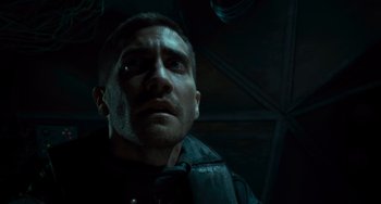 Movie still from “Source Code” (2011), directed by Duncan Jones – A person looking up at the sky; Close Up shot, Low angle