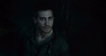 Movie still from “Source Code” (2011), directed by Duncan Jones – A person wearing a jacket; Close Up shot, High angle