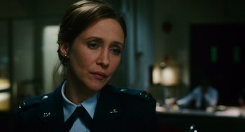 Movie still from “Source Code” (2011), directed by Duncan Jones – A woman in a military uniform looking to her left; Close Up shot, Over the shoulder angle