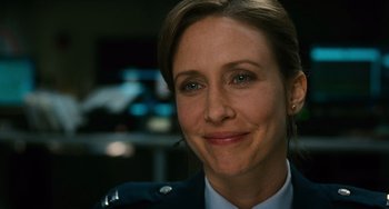 Movie still from “Source Code” (2011), directed by Duncan Jones – A person wearing a uniform smiling; Close Up shot, Over the shoulder angle