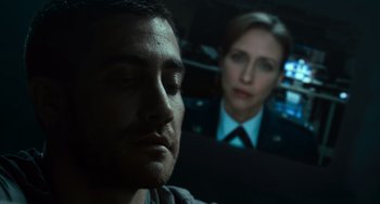 Movie still from “Source Code” (2011), directed by Duncan Jones – A man and a woman in a police uniform; Close Up shot, Low angle