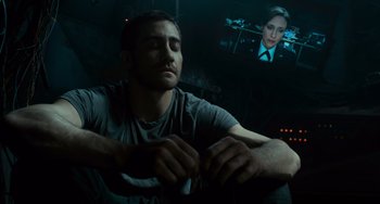 Movie still from “Source Code” (2011), directed by Duncan Jones – A man sitting in front of a television screen; Close Up shot, Over the shoulder angle