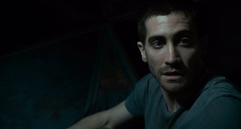 Movie still from “Source Code” (2011), directed by Duncan Jones – A person looking at the camera; Close Up shot, Low angle