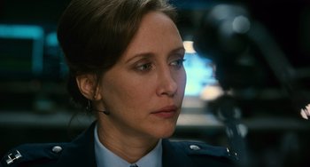 Movie still from “Source Code” (2011), directed by Duncan Jones – A person wearing a uniform; Close Up shot, Over the shoulder angle