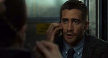 Movie still from “Source Code” (2011), directed by Duncan Jones – A person talking on a cell phone; Close Up shot, Over the shoulder angle