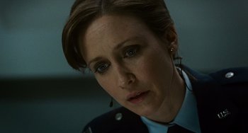 Movie still from “Source Code” (2011), directed by Duncan Jones – A person wearing a police uniform; Close Up shot, Low angle