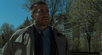 Movie still from “Source Code” (2011), directed by Duncan Jones – A person wearing a jacket and tie; Close Up shot, Low angle