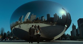 Movie still from “Source Code” (2011), directed by Duncan Jones – Two people are standing in front of a large sphere; Extreme Wide shot, Low angle