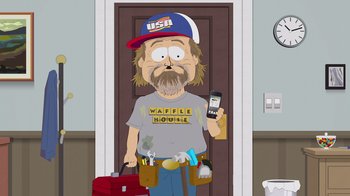 Movie still from “South Park: Joining the Panderverse” (2023), directed by Trey Parker – A cartoon of a man holding a cell phone and a tool belt; Medium shot, Low angle