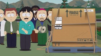 Movie still from “South Park: Joining the Panderverse” (2023), directed by Trey Parker – A group of people standing in front of a cardboard box; Wide shot, High angle