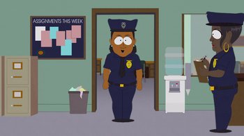 Movie still from “South Park: Joining the Panderverse” (2023), directed by Trey Parker – A cartoon of a police officer standing in front of a room; Medium shot, Over the shoulder angle