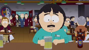 Movie still from “South Park: Joining the Panderverse” (2023), directed by Trey Parker – A man sitting at a table holding a glass of beer; Medium shot, Over the shoulder angle