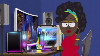 Movie still from “South Park: Joining the Panderverse” (2023), directed by Trey Parker – A woman is sitting in front of a computer monitor; Medium shot, High angle