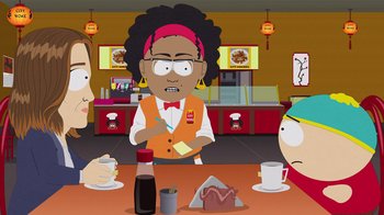 Movie still from “South Park: Joining the Panderverse” (2023), directed by Trey Parker – A group of people sitting at a table in a restaurant; Medium shot, Over the shoulder angle