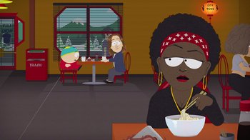Movie still from “South Park: Joining the Panderverse” (2023), directed by Trey Parker – Two people sitting at a table in front of a window; Medium shot, Over the shoulder angle