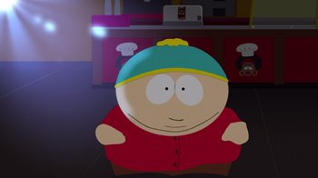 Movie still from “South Park: Joining the Panderverse” (2023), directed by Trey Parker – A cartoon character is sitting in front of a counter; Medium shot, High angle