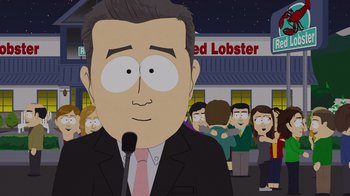 Movie still from “South Park: Joining the Panderverse” (2023), directed by Trey Parker – A man in a suit and tie standing in front of a group of people; Medium shot, Over the shoulder angle