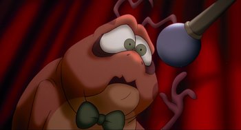 Movie still from “Space Jam” (1996), directed by Joe Pytka – An animated picture of a man with a bow tie; Close Up shot, High angle