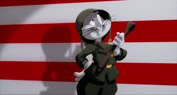 Movie still from “Space Jam” (1996), directed by Joe Pytka – A cartoon character in a uniform holding a guitar; Medium shot, Low angle