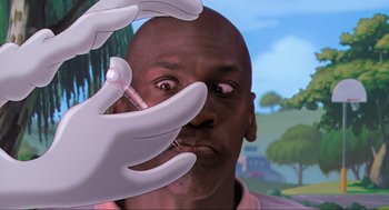 Movie still from “Space Jam” (1996), directed by Joe Pytka – A man with his mouth wide open looking at the camera; Extreme Close Up shot, Low angle
