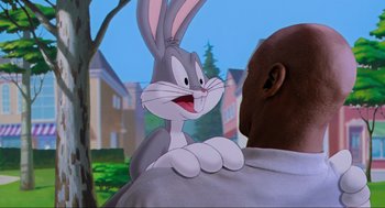 Movie still from “Space Jam” (1996), directed by Joe Pytka – Bugs bunny from the looney tunes cartoon; Medium shot, Over the shoulder angle