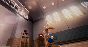 Movie still from “Space Jam” (1996), directed by Joe Pytka – An animated rabbit is playing basketball in a gym; Wide shot, Low angle
