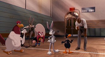 Movie still from “Space Jam” (1996), directed by Joe Pytka – A group of cartoon characters standing on a basketball court; Wide shot, High angle