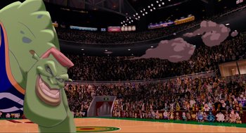 Movie still from “Space Jam” (1996), directed by Joe Pytka – An audience is in the stands of a baseball game; Wide shot, Low angle
