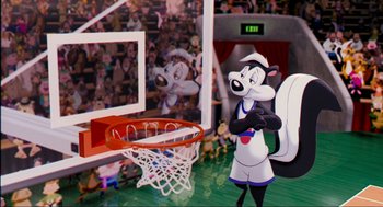 Movie still from “Space Jam” (1996), directed by Joe Pytka – A cartoon character is standing in front of a basketball hoop; Wide shot, High angle