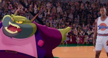 Movie still from “Space Jam” (1996), directed by Joe Pytka – A cartoon character in front of an audience; Medium shot, Low angle