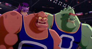 Movie still from “Space Jam” (1996), directed by Joe Pytka – A group of cartoon characters sitting on top of each other; Medium shot, Low angle